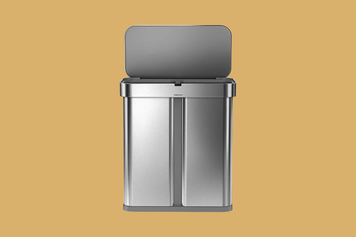 metal trash can on yellow background