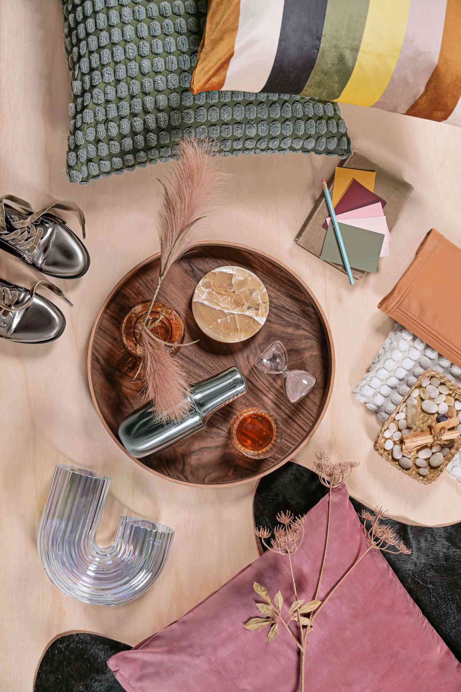 Wood table styled with coasters and more. 