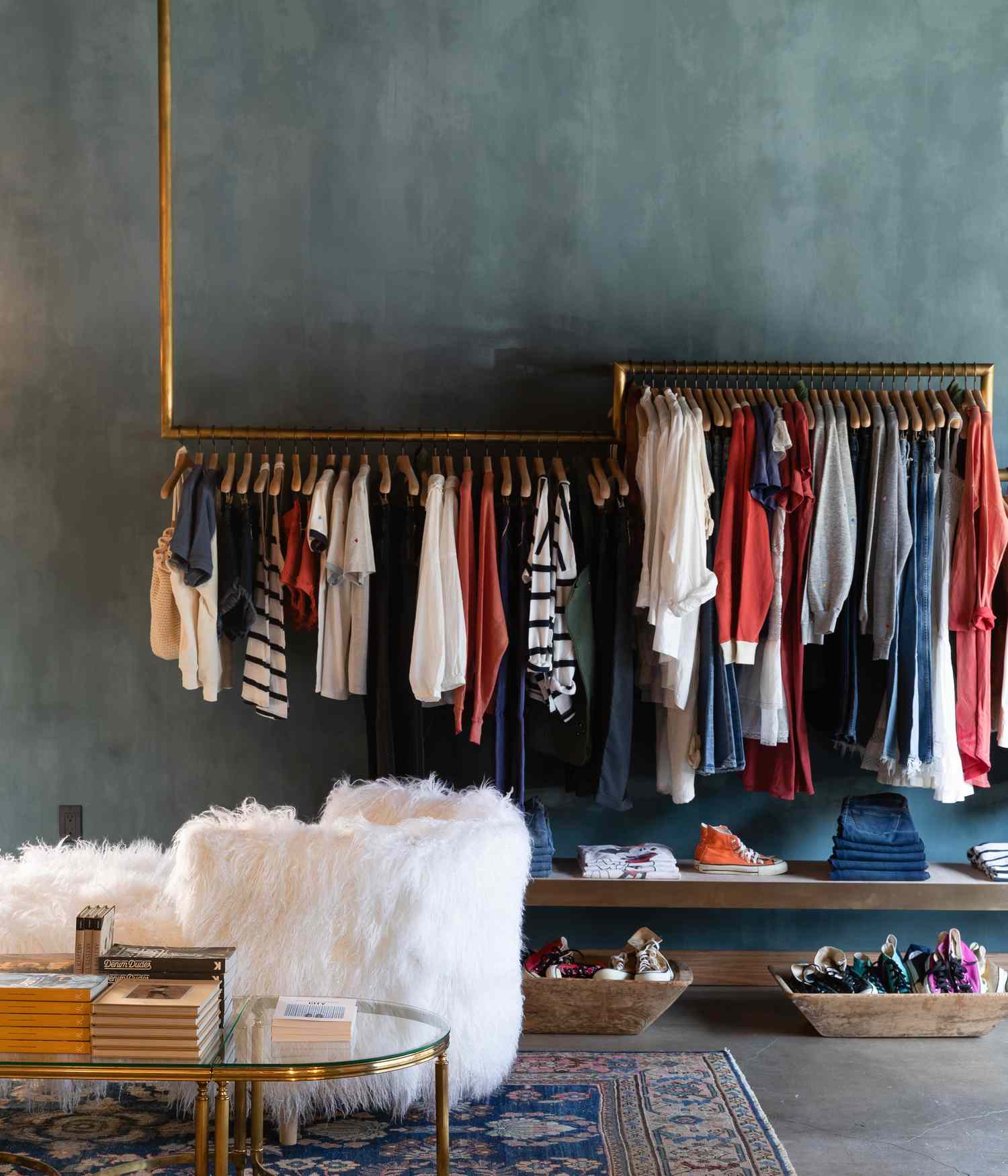 clothes hanging in front of a blue wall
