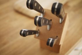 wooden knife block holding knives