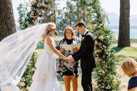 bride and groom holding hands during wedding ceremony vows