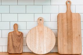 Three wooden cutting boards of different shapes and sizes on a counter