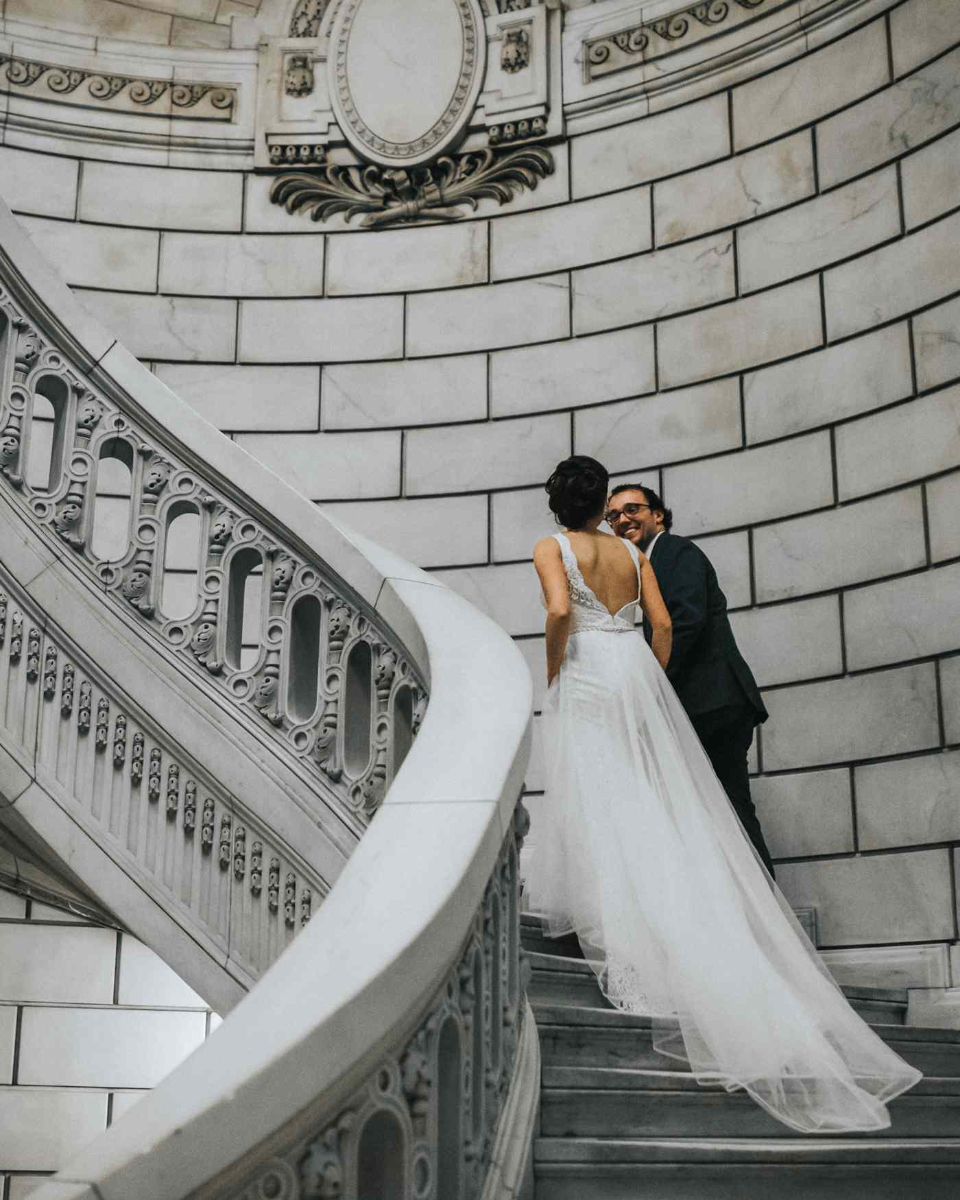 city hall wedding bride and groom walking up winding staircase