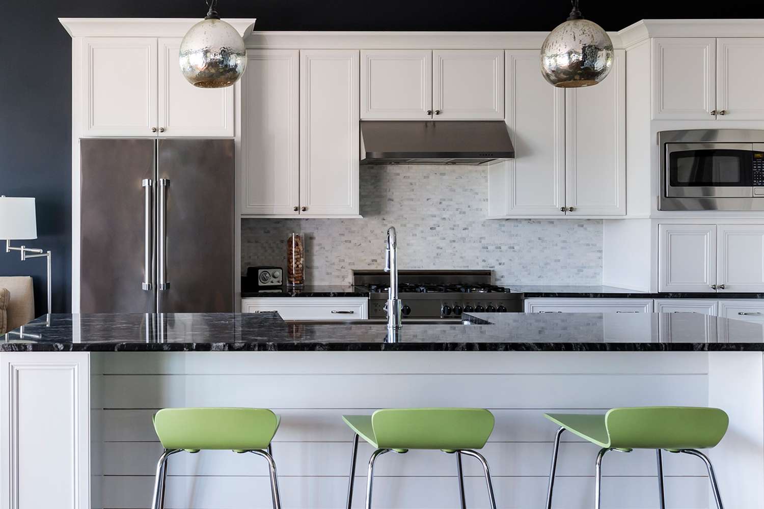 White kitchen with green stools