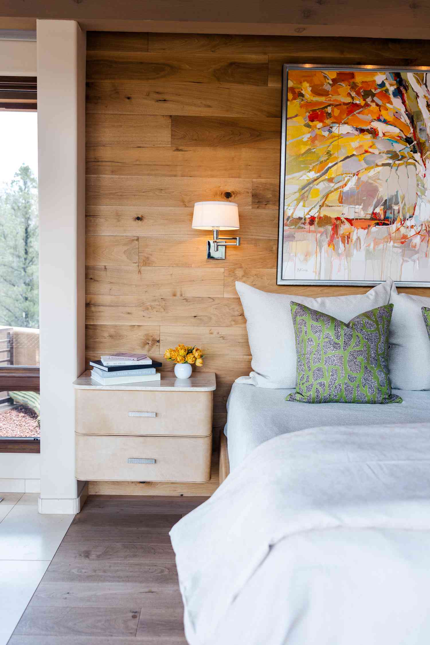 a bedroom with wood walls
