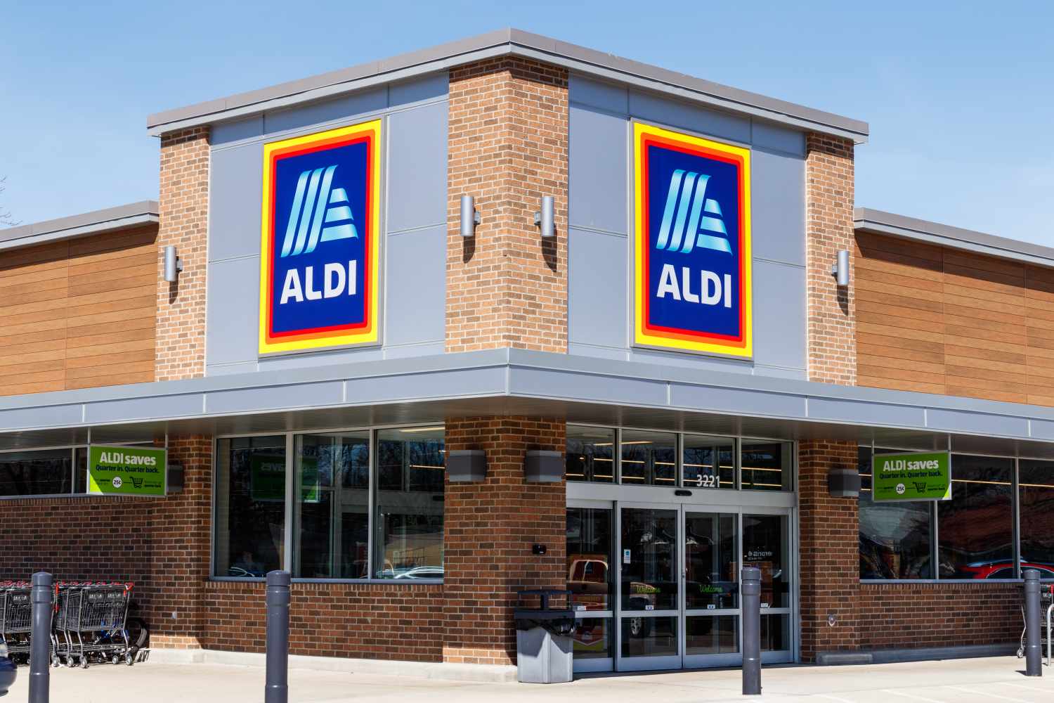 Exterior view of an Aldi grocery store front showing the logo and entrance