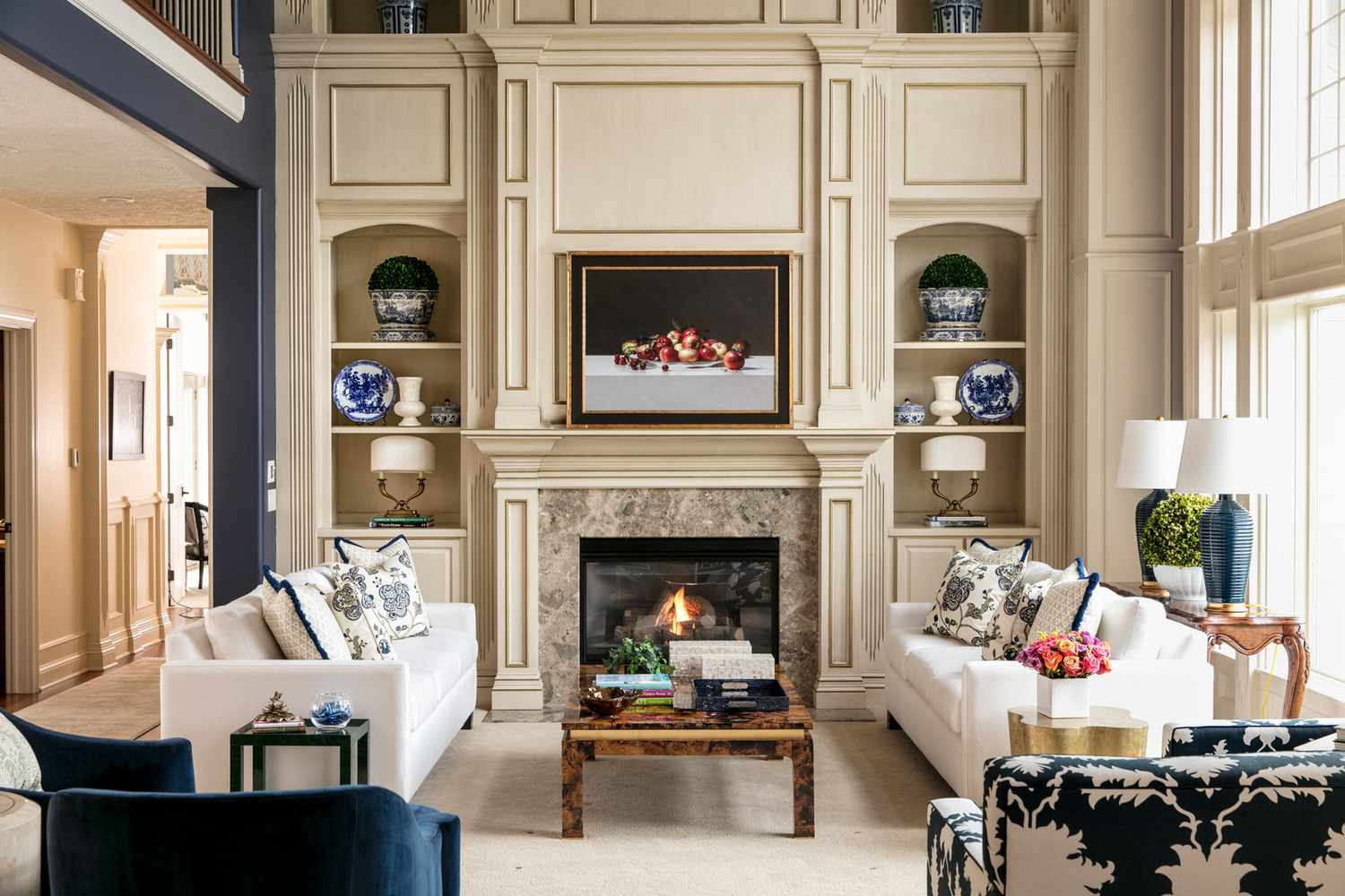 double built in bookshelf on either side of fireplace