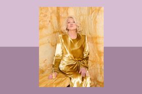 decorvow in a gold outfit sitting against a marble background