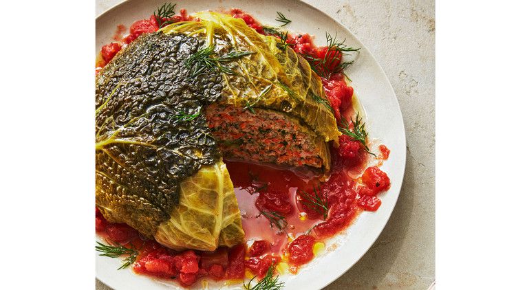 whole stuffed cabbage served on a white plate