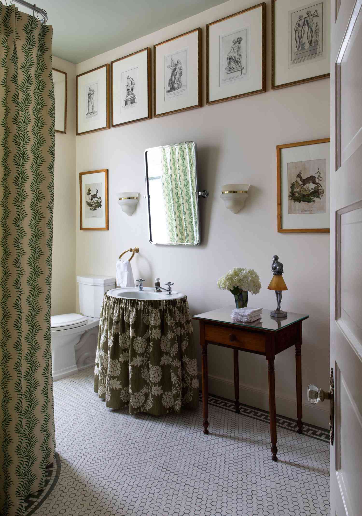 Bathroom with frames lining the walls