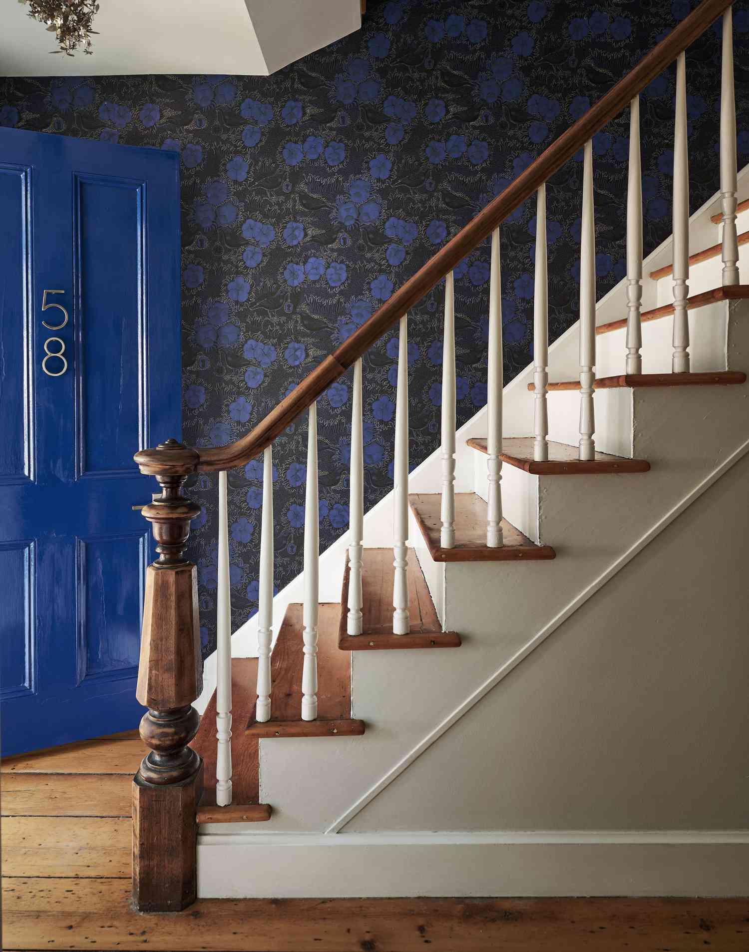 original staircase with blue front door