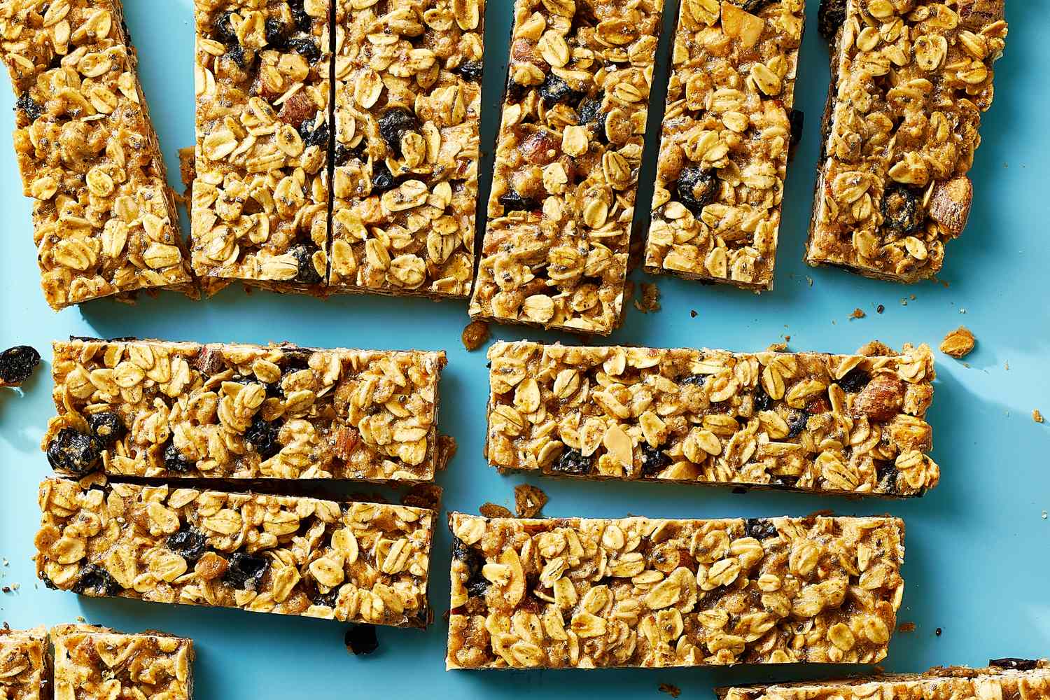 Several granola bars placed on a blue surface