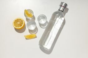 bottle of vodka and orange slices.