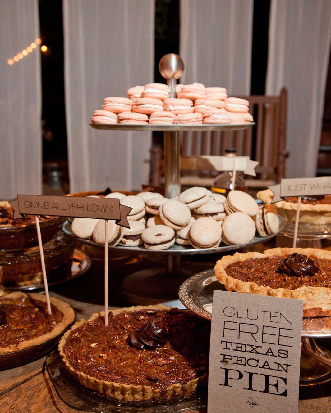 A dessert bar with macarons and Texas pecan pies