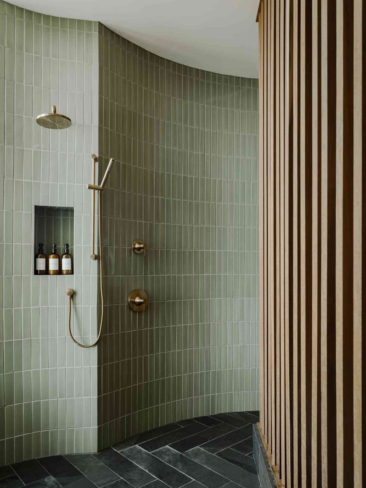 A green subway tiled walk-in shower 