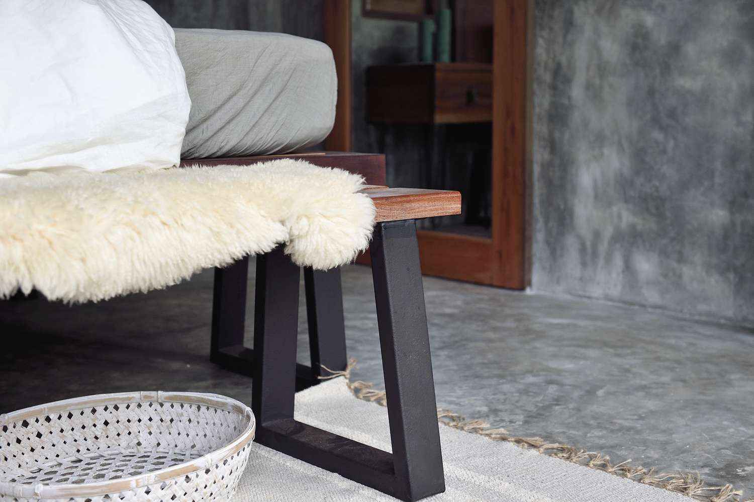 bedroom with sheepskin rug on bench