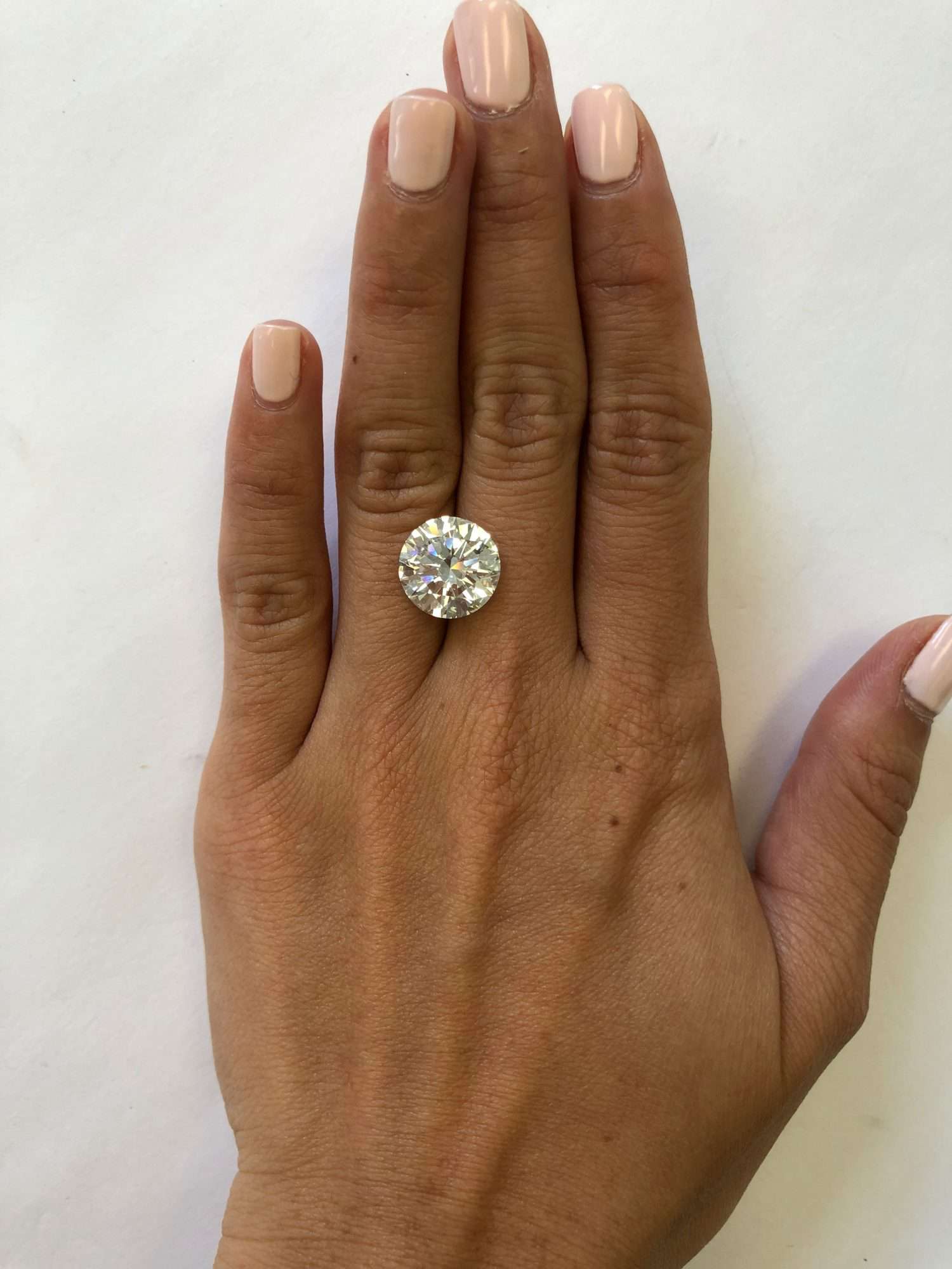 hand with 6 carat diamond