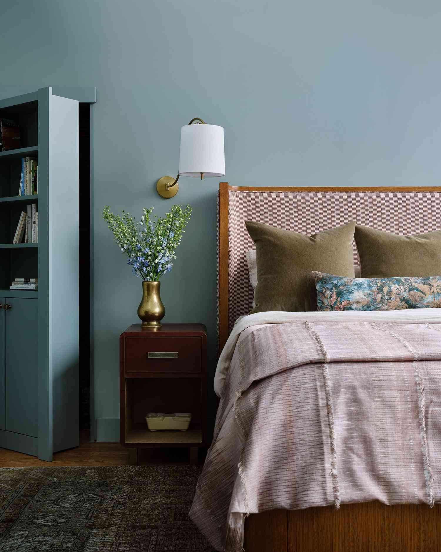 blue bedroom with secret bookcase