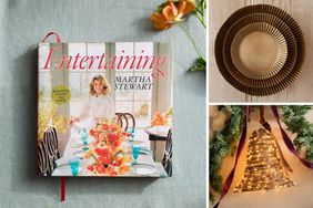 Entertaining book by decorvow decorative items including plates and a lighted bell a flower on the left