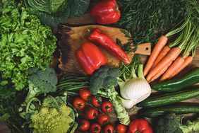 vegetables, peppers, broccoli, tomatoes, carrots, lettuce on wood surface
