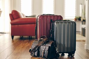 Red, gray, and leather suitcases