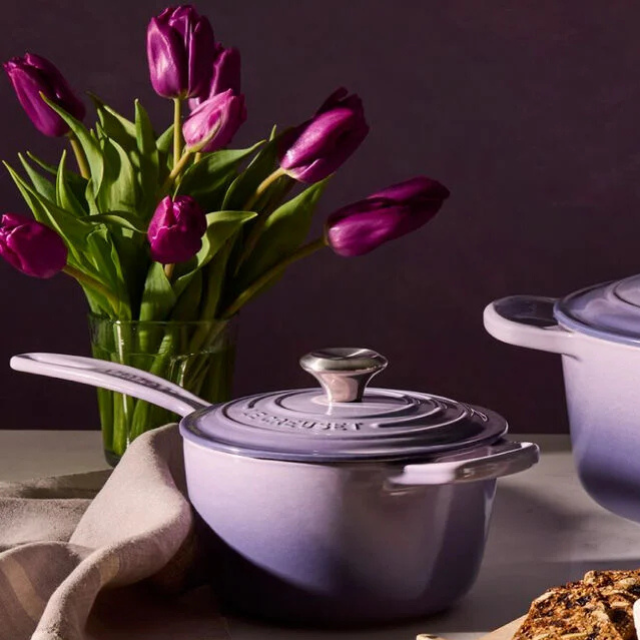 Purple Dutch oven and saucepan tulip bouquet on a table