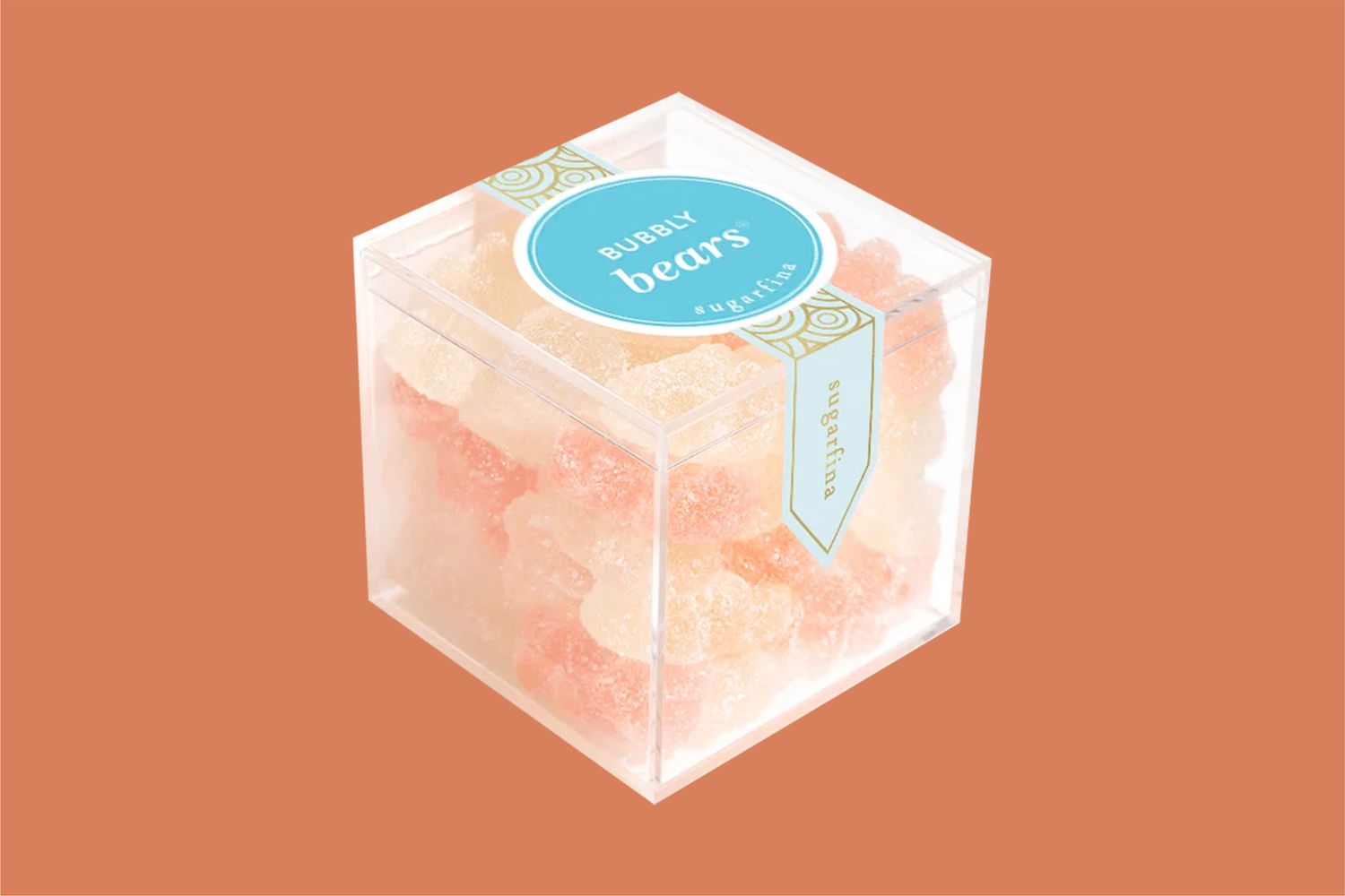 bubbly champagne gummy bears on orange background