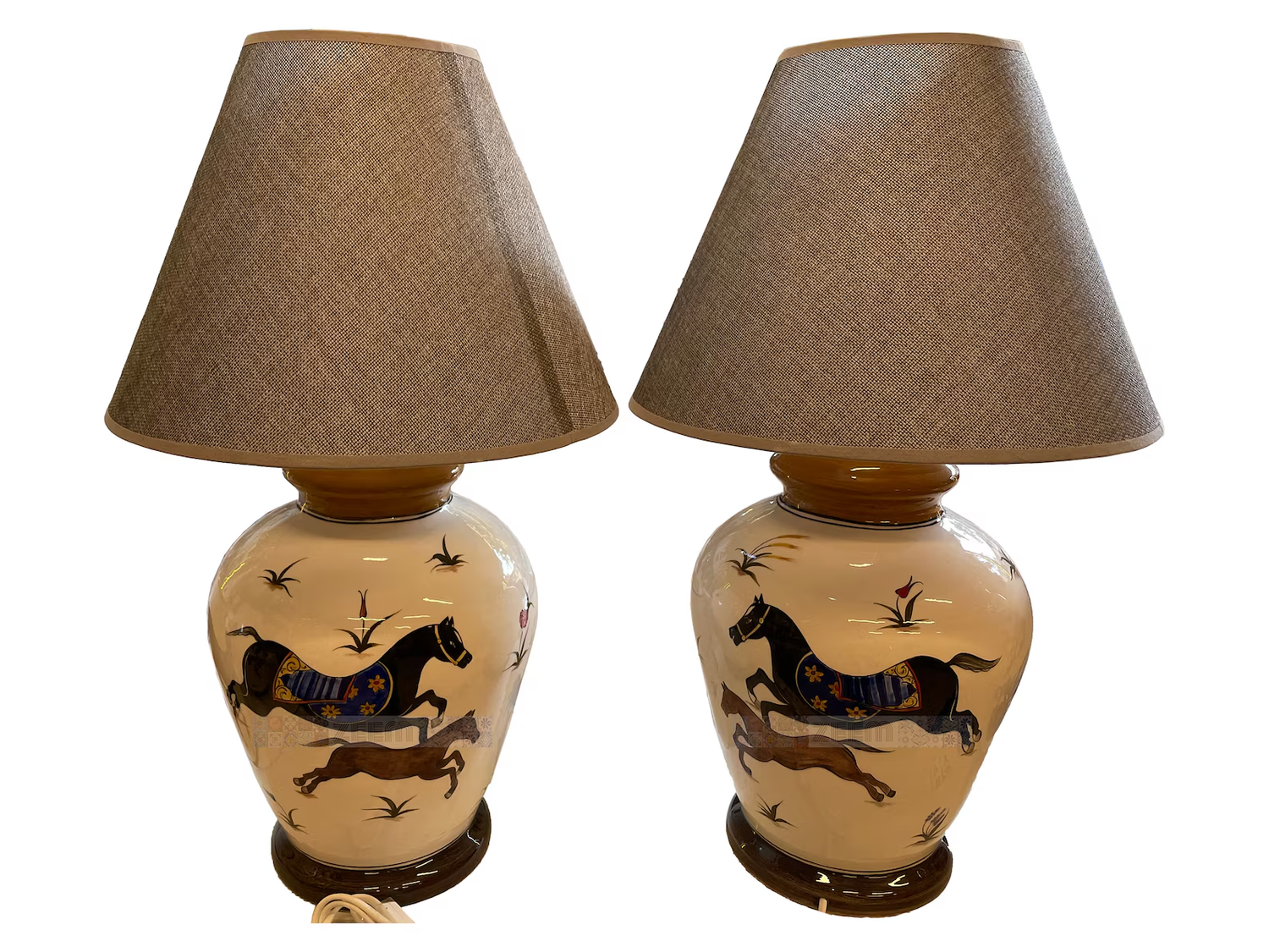 Pair of decorative table lamps with horsethemed ceramic bases and fabric shades