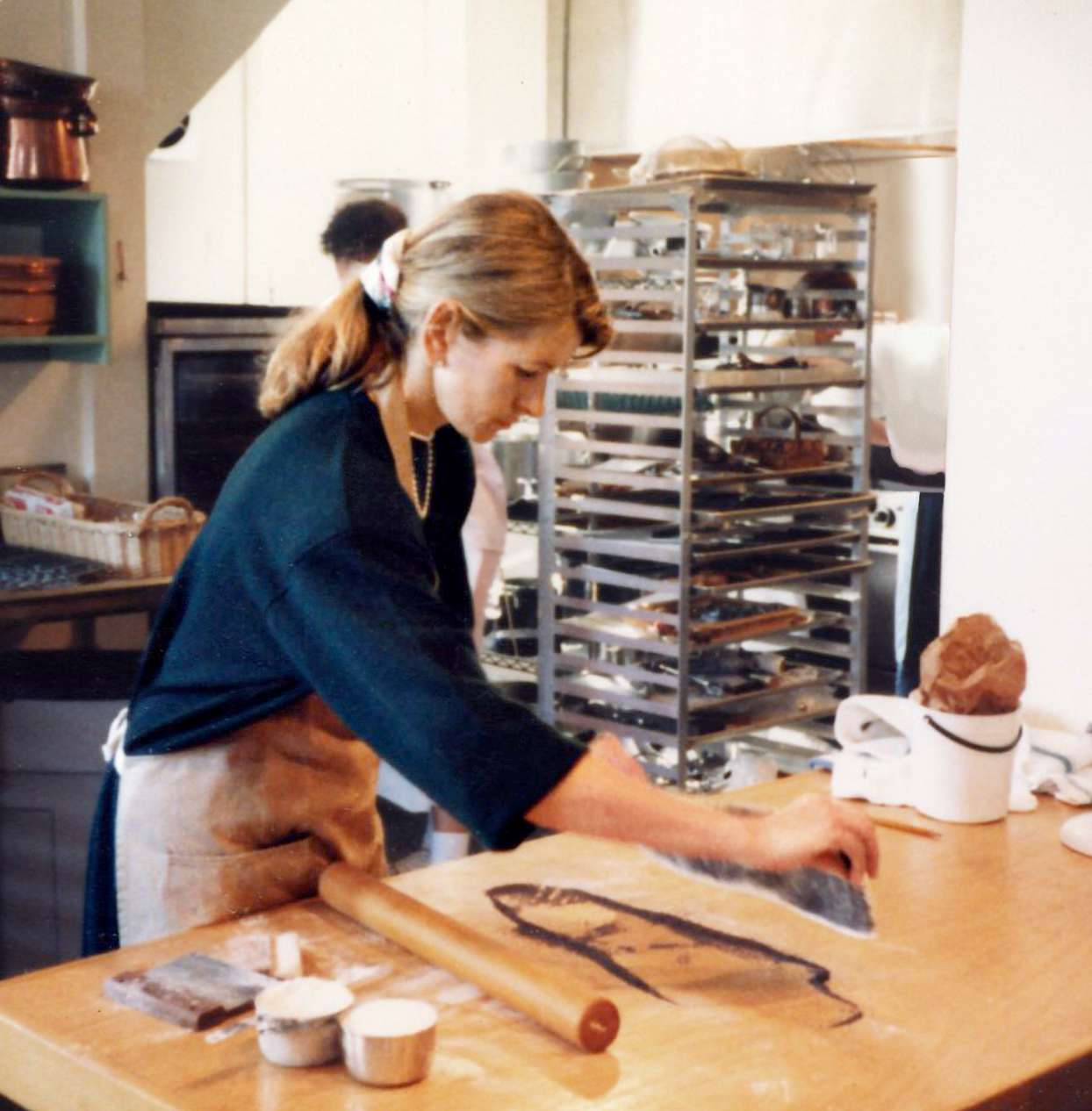 Martha in kichen where she runs catering business and teaches cooking seminars