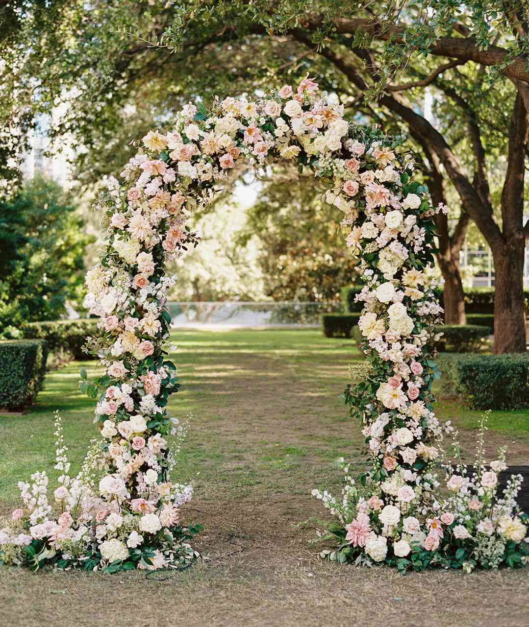floral arch color scheme of white, blush, ivory, and greenery