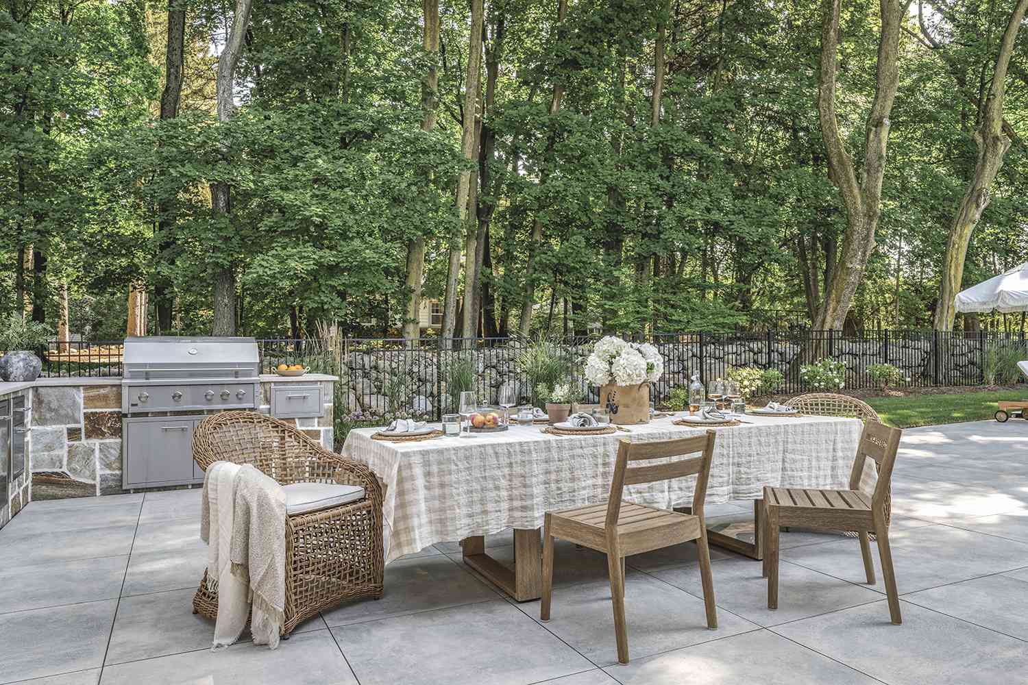 A flat outdoor patio with a set table 
