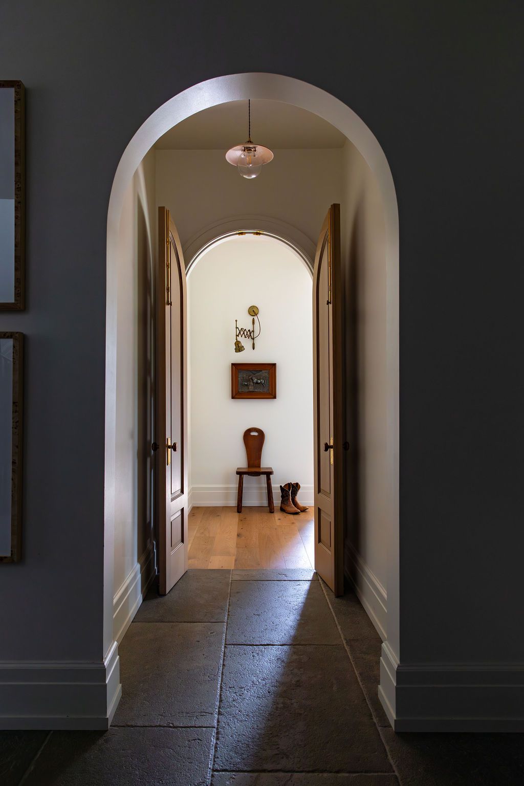 hallway with arches and matching wooden doors