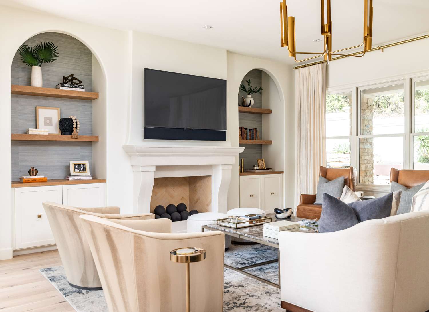 living room with arched built ins