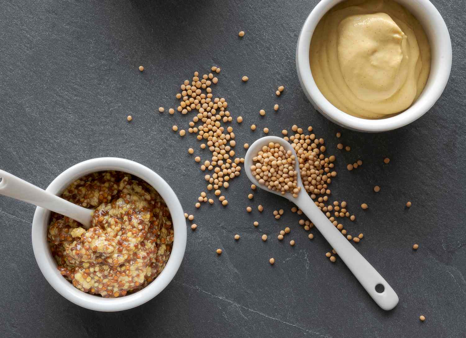 overhead view of dijon and seeded mustard and mustard seeds