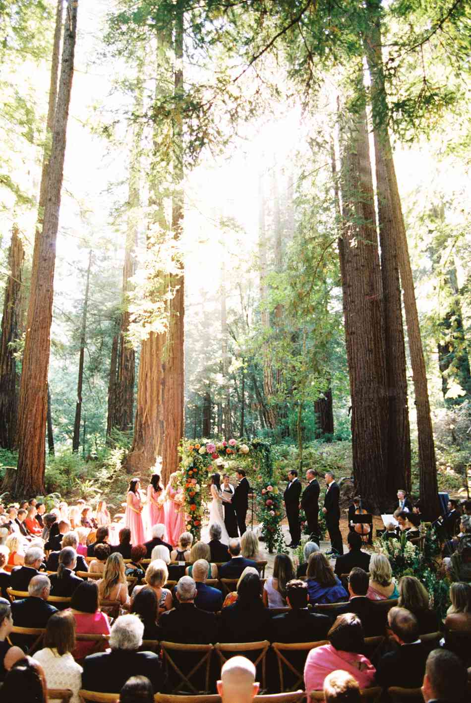 bride and groom during outdoor forest wedding ceremony