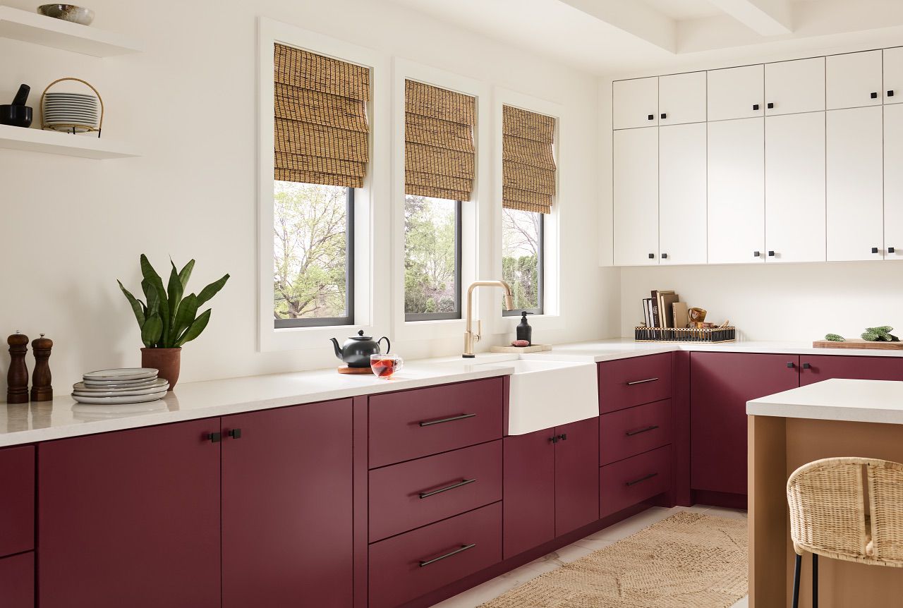 Kitchen with maroon cabinets