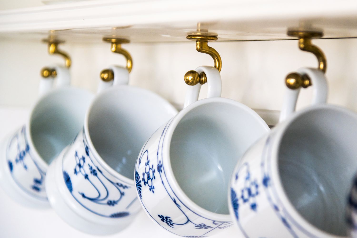 Mugs hanging in kitchen