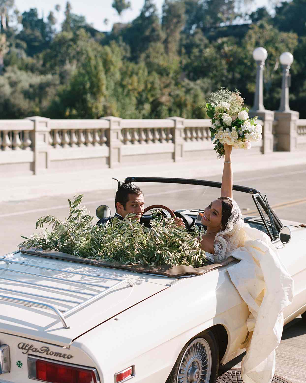 pia davide wedding couple in getaway car