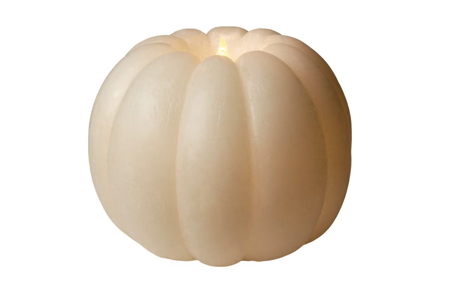 A pumpkinshaped candle lit at the wick