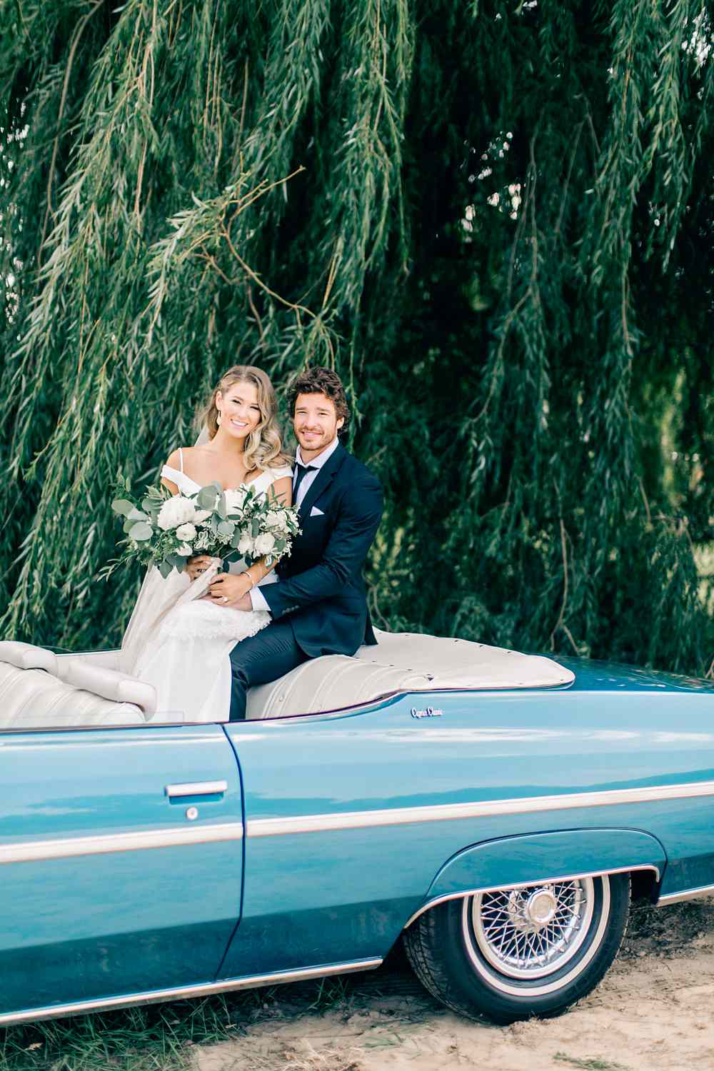 maggie zach wedding couple in vintage car