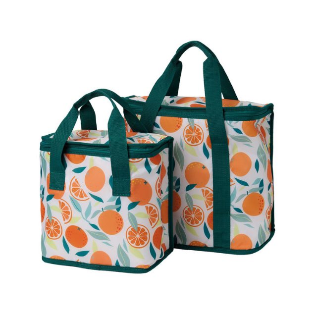Two reusable shopping bags with orange fruit designs and green handles standing side by side
