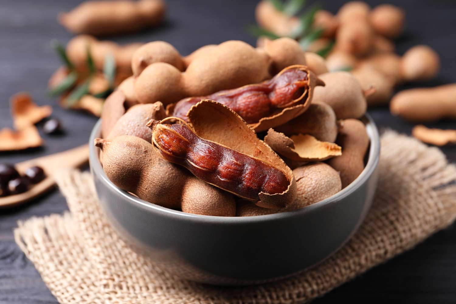 tamarind pods in ceramic bowl