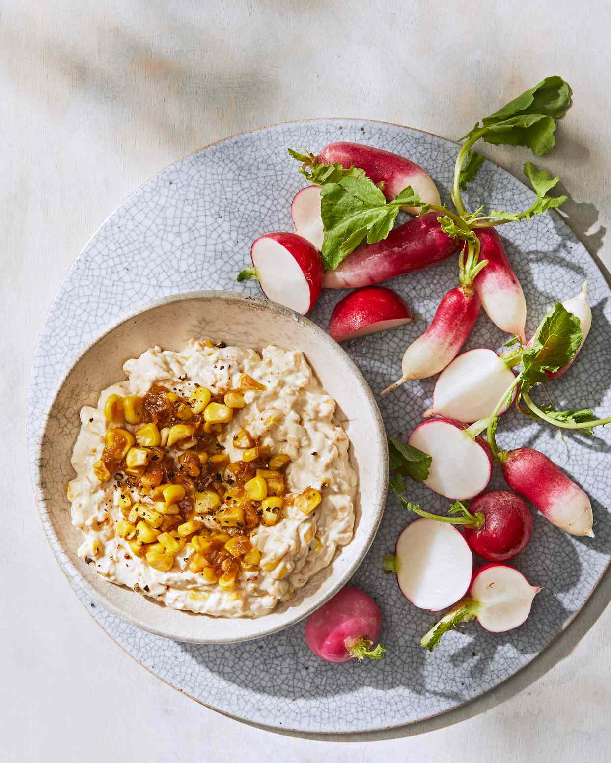 creamy corn-and-onion dip served with radishes