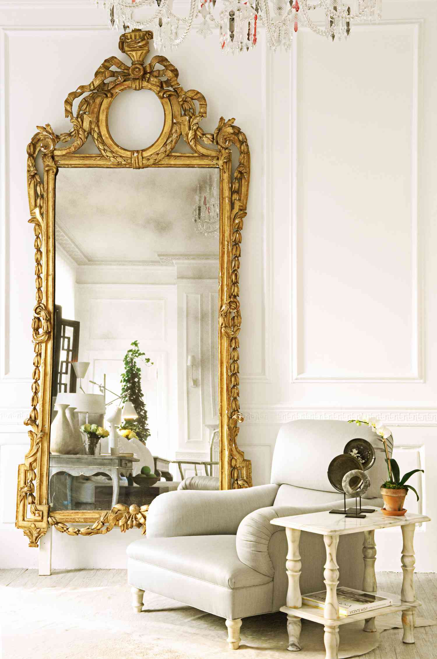 Living room with gold ornate mirror