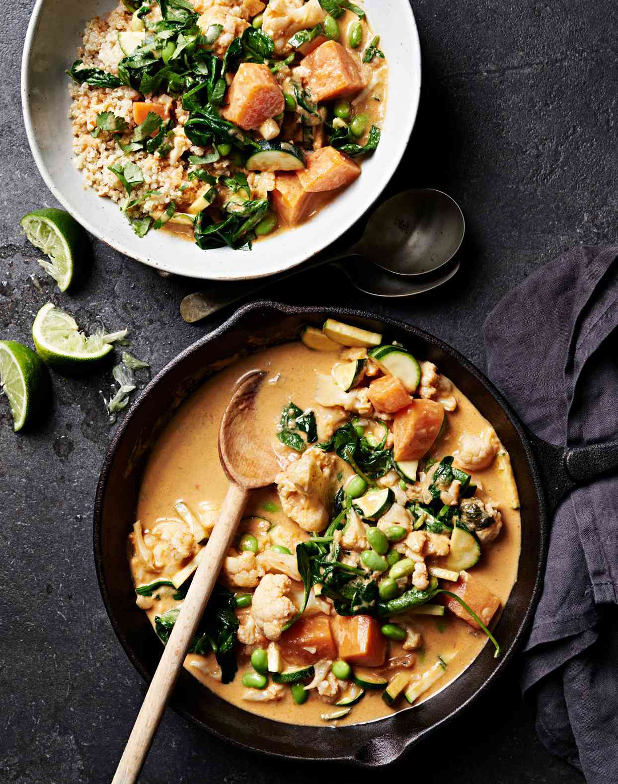 cauliflower-sweet potato curry served with cilantro and lime