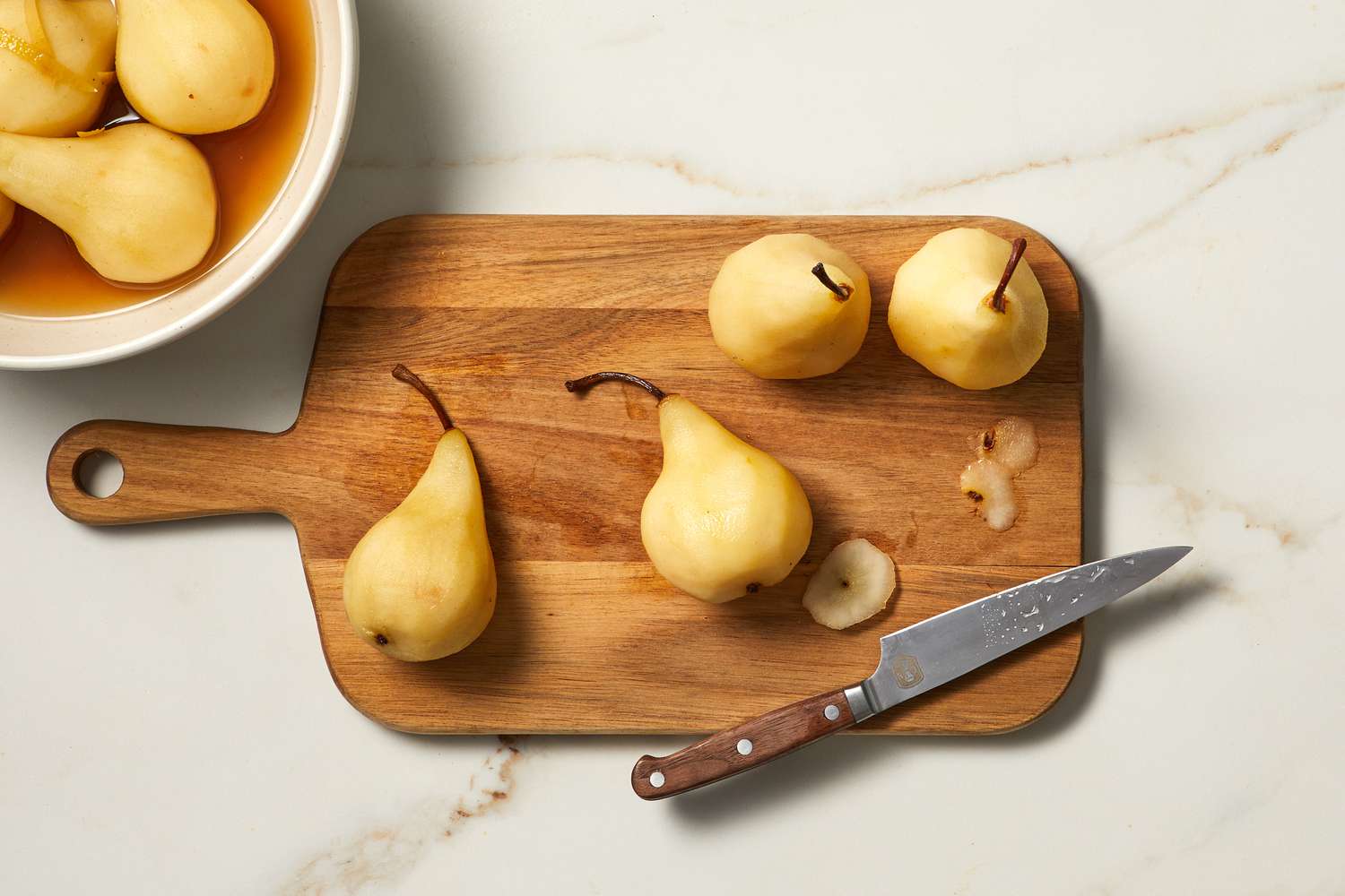 peeled pears on a cutting boaed
