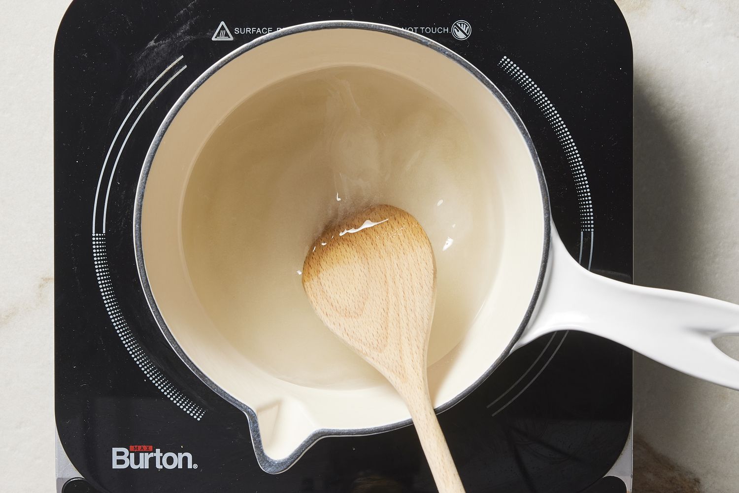 Water and sugar in saucepan