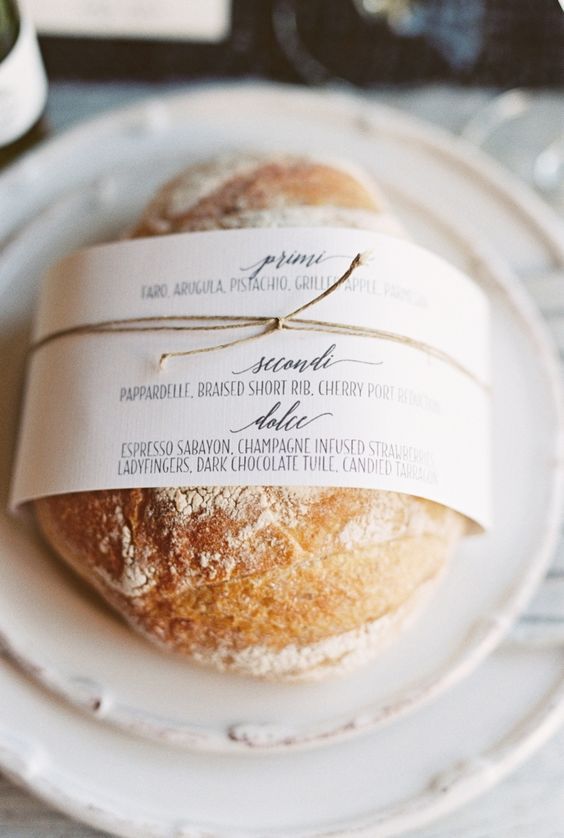 bread wrapped in menu sleeve on plates