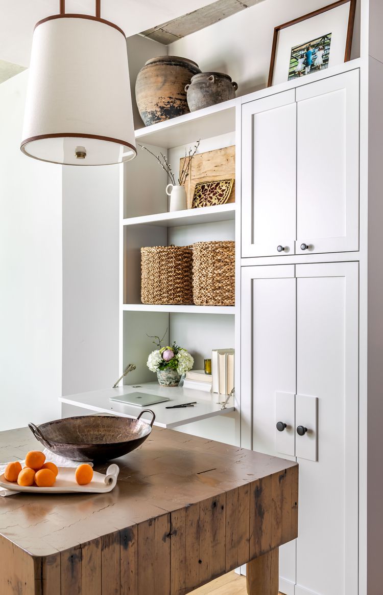 curated collection above kitchen cabinets