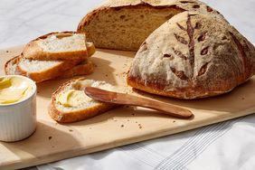 artisan boule bread martha bakes cutting board slice butter